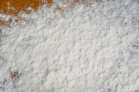 Top side view on white flour on rustic wooden table background, closeup of healthy cooking copyspace surface at home or restaurant, fabric plantの写真素材