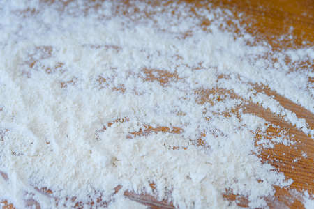 Top side view on white flour on rustic wooden table background, closeup of healthy cooking copyspace surface at home or restaurant, fabric plantの写真素材