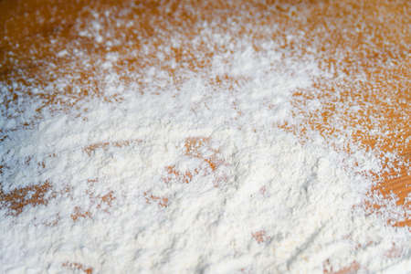 Top side view on white flour on rustic wooden table background, closeup of healthy cooking copyspace surface at home or restaurant, fabric plantの写真素材