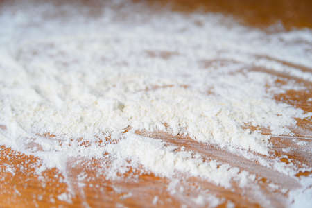 Top side view on white flour on rustic wooden table background, closeup of healthy cooking copyspace surface at home or restaurant, fabric plantの写真素材