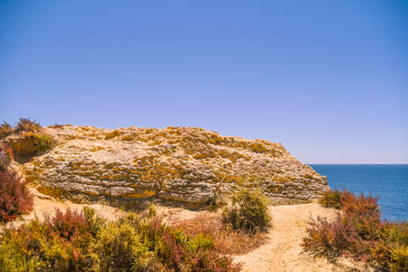 Bright blue sky and sea natural Algarve Portugal outdoors background. Sunny day travel vacation destination panoramic imagesの写真素材