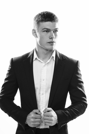 Portrait of handsome stylish man in black suitの写真素材