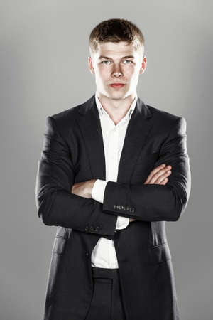 Portrait of handsome stylish man in black suitの写真素材