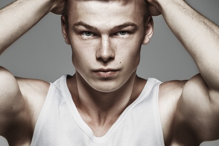 Portrait of handsome stylish man in white t-shirtの写真素材