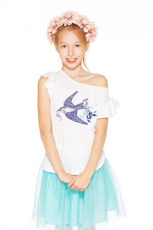 Little girl posing for the camera in wreathの写真素材