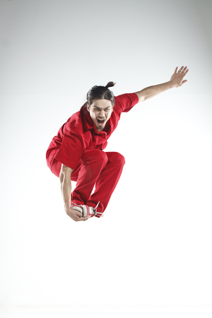 Young men dancer doing jumps and difficult elementsの写真素材