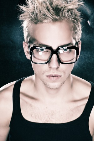 Beautiful men in the black shirt  against the metallic backgroundの写真素材