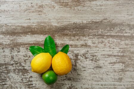 Background with copy space on wooden table with lemonsの写真素材