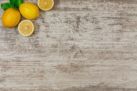 Background with copy space on wooden table with lemonsの写真素材