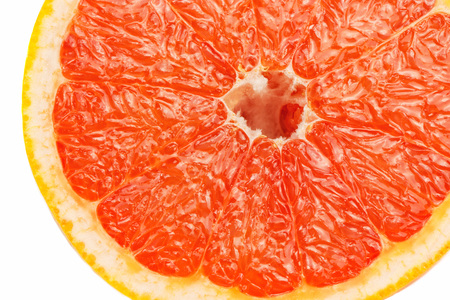 Slice a fresh juicy red round grapefruitの写真素材