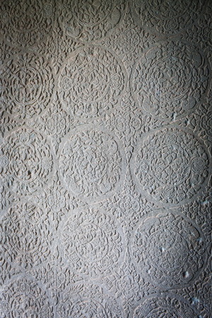 Beautiful ornament on the wall in the temple of Cambodiaの写真素材