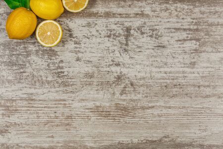 Background with copy space on wooden table with lemonsの写真素材