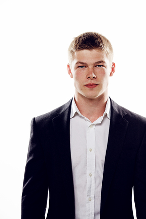Portrait of handsome stylish man in black suitの写真素材