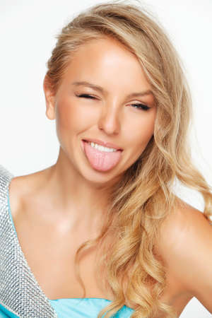 Blonde model in blue dress on white backgroundの写真素材