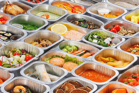 Separate portions of different food into containersの写真素材