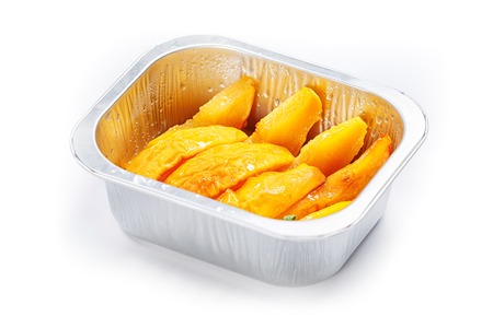 Portion of food in the container isolated on whiteの写真素材