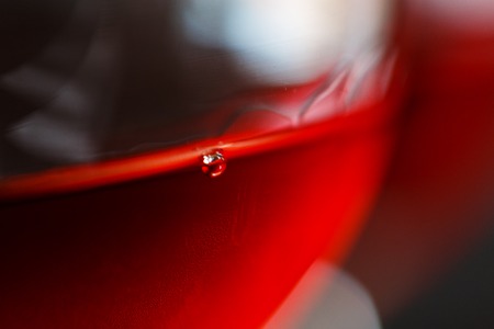 Macro view of a red wine in a glassの写真素材