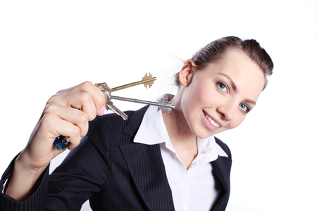 Business woman in suit with the keysの写真素材