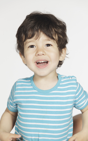 Cute smiling little boy on white backgroundの写真素材