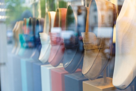 Showcase with shoes of different colors in the streetの写真素材