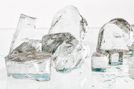Ice cubes on a wet table studio shot