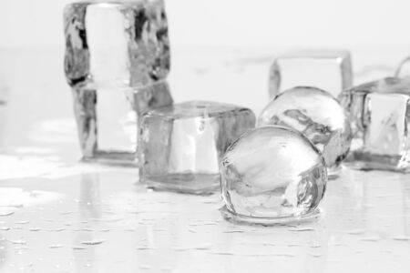 Ice cubes and balls on a wet table studio shotの写真素材