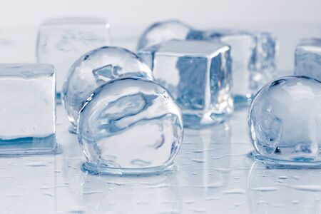 Ice cubes and balls on a wet table studio shotの写真素材