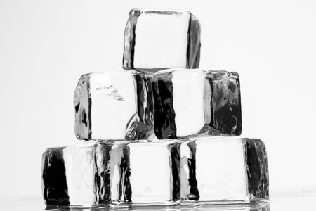 Ice cube on a wet table studio shotの写真素材