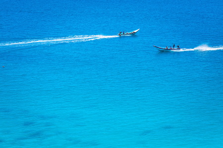 Two boats in the crystal clear azure oceanの写真素材