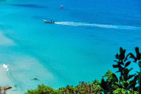 Two boats in the crystal clear azure ocean