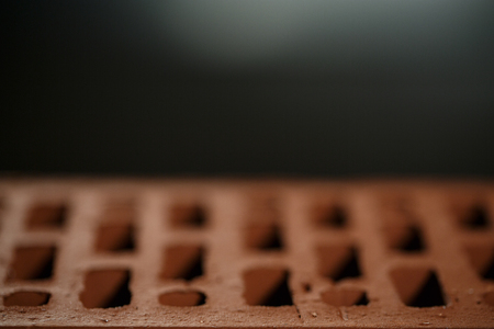 Closeup view of bricks with holes studio shotの写真素材