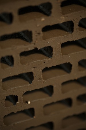 Closeup view of bricks with holes studio shotの写真素材