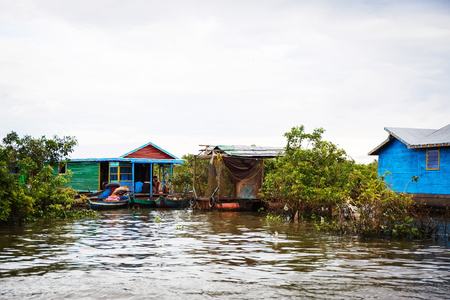 Floating village in Cambodia with houses on the riverの写真素材