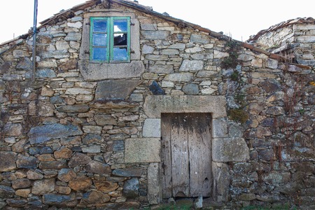 Old rustic wooden beige door in Spainの写真素材