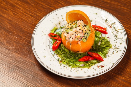 Stuffed with shrimp orange on a white plateの写真素材