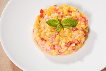 Fruit dessert of mango and strawberry with mintの写真素材