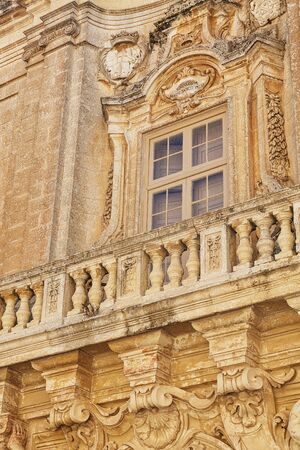 Balconies in Malta on the stone facade of historical townhousesの写真素材
