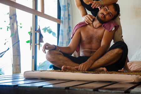 Young man on a massageの写真素材