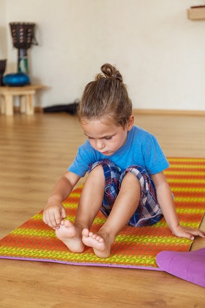 Little boy on a yoga classの写真素材