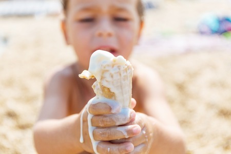 Boy eating ice creamの写真素材