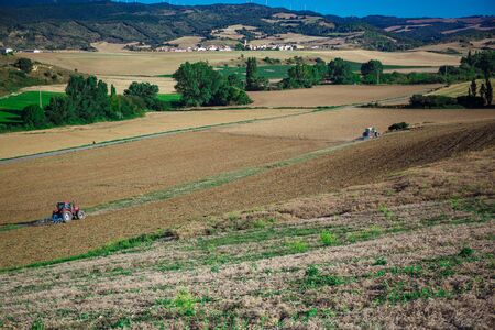 Tractor plowing fieldの写真素材