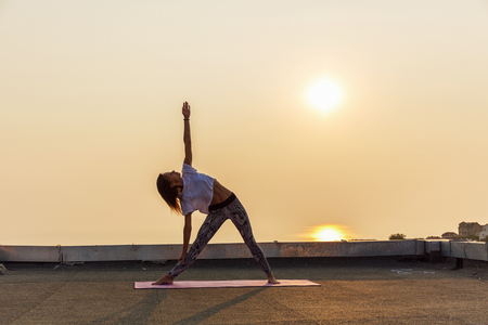 Young woman practicing yogaの写真素材