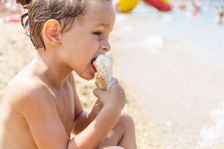 Boy eating ice creamの写真素材