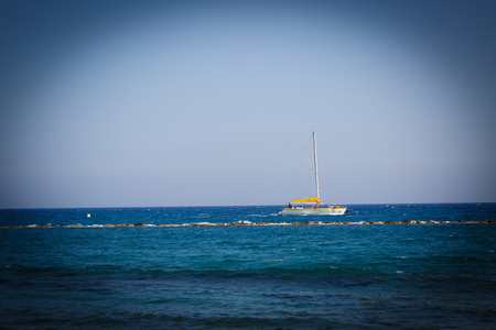 White alone ship at the blue seaの写真素材
