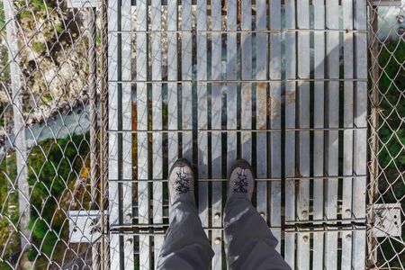 Suspension bridge in the mountains in Nepalの写真素材