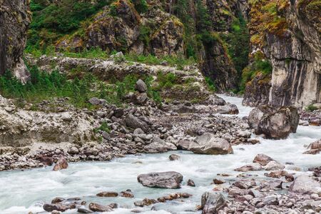Pure mountain river in the mountains of Nepalの写真素材