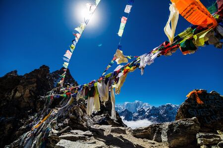 Colorful flags in the mountains of Nepalの写真素材