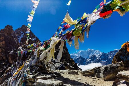 Colorful flags in the mountains of Nepalの写真素材
