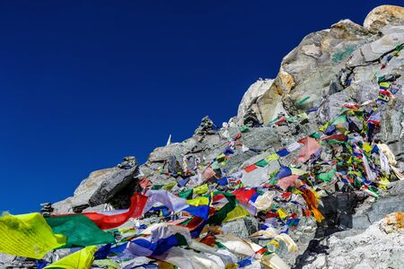 Colorful flags in the mountains of Nepalの写真素材