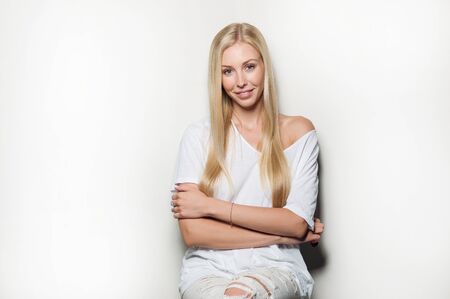 Portrait of a beautiful woman in white clothesの写真素材